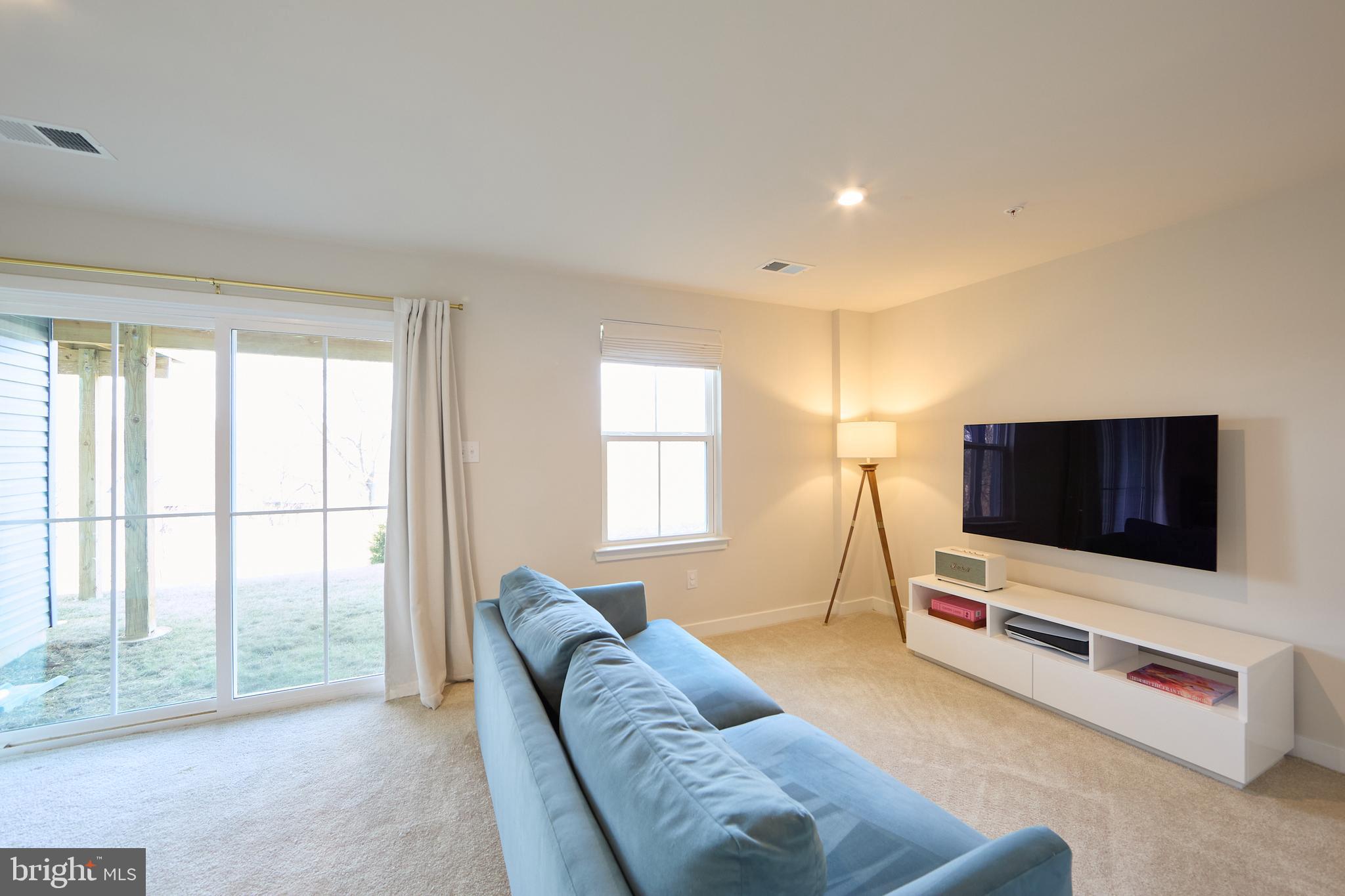 463 Paperbark Square Downingtown, PA 19335 - Photo 11 of 31 a living room with furniture and a flat screen tv