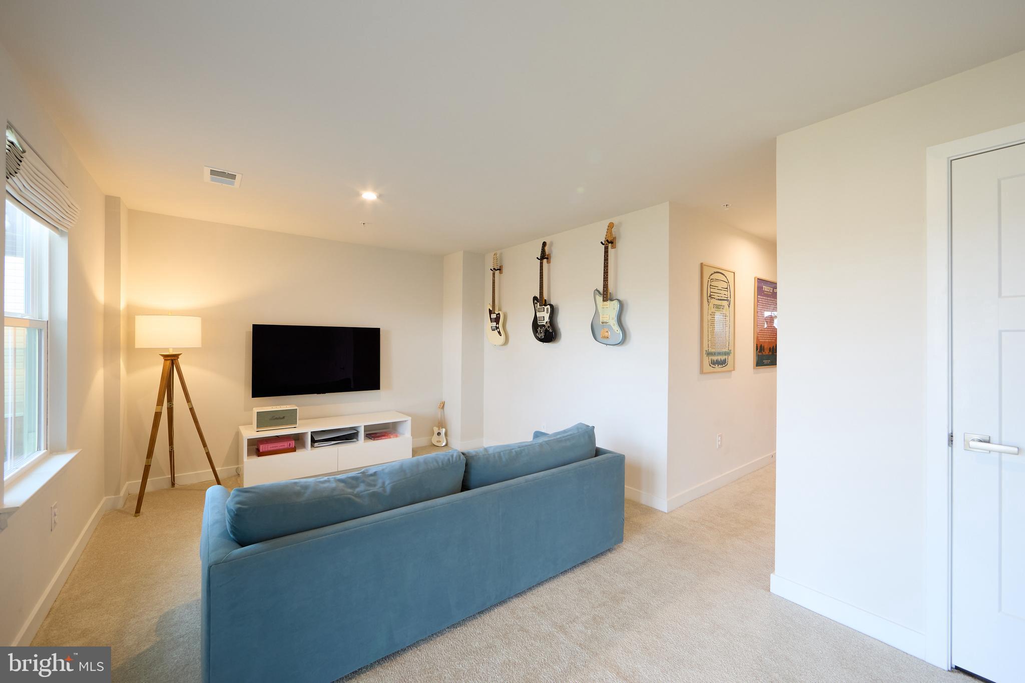 463 Paperbark Square Downingtown, PA 19335 - Photo 12 of 31 a living room with furniture and a flat screen tv