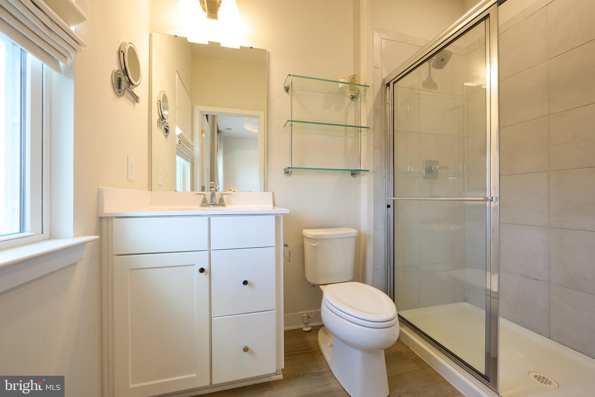 463 Paperbark Square Downingtown, PA 19335 - Photo 17 of 31 a bathroom with a toilet a sink and shower