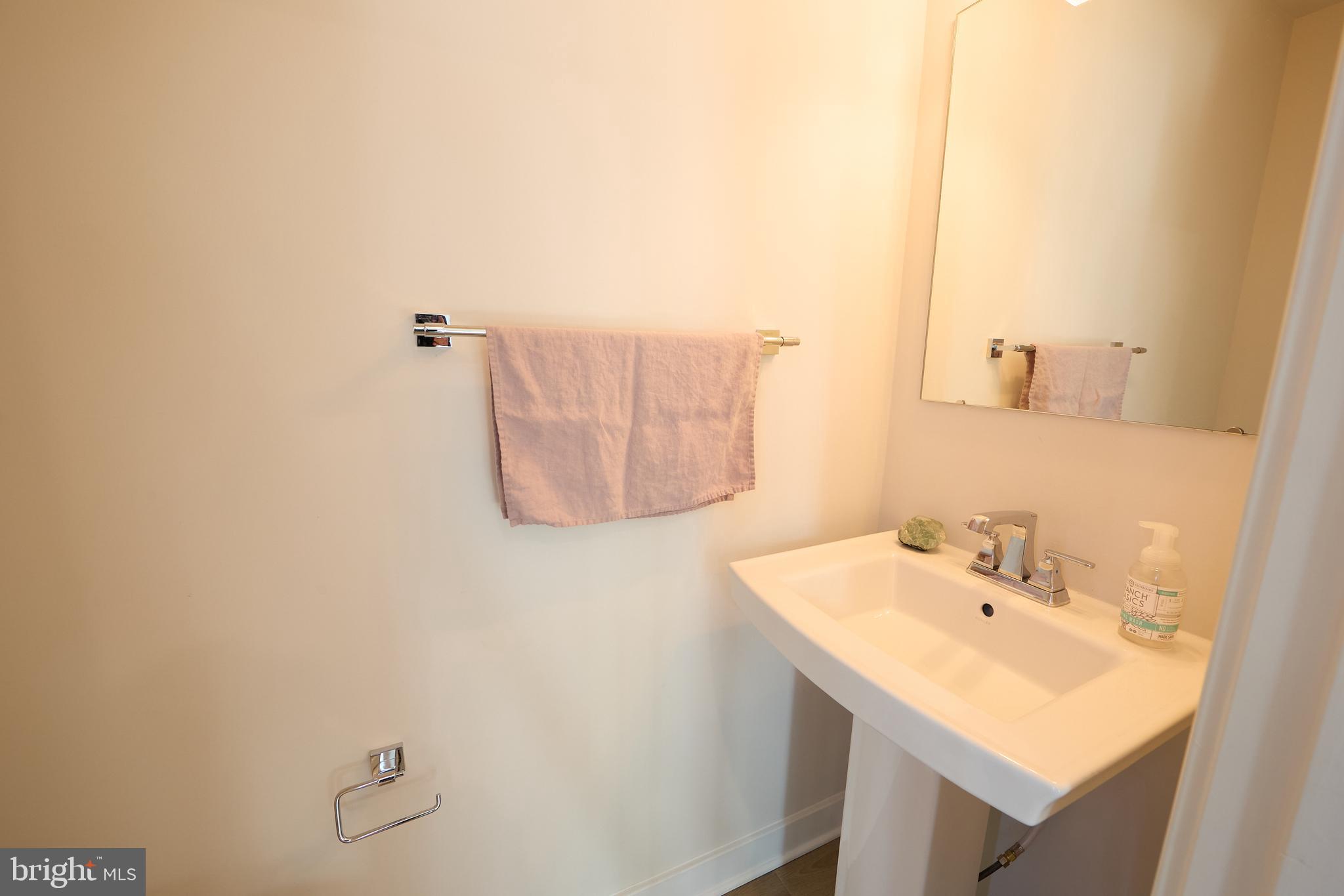 463 Paperbark Square Downingtown, PA 19335 - Photo 23 of 31 a bathroom with a sink and a mirror