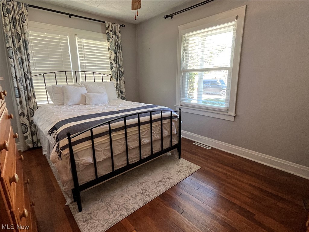 1902 Mathoit Street Parkersburg, WV 26101 - Photo 14 of 35 Bedroom with multiple windows and dark hardwood floors