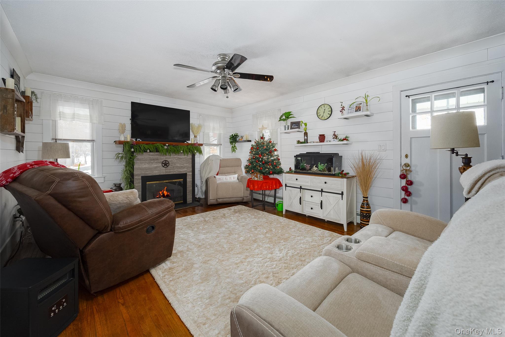 28 Red Oaks Mill Road Poughkeepsie, NY 12603 - Photo 5 of 21 a living room with furniture and a flat screen tv