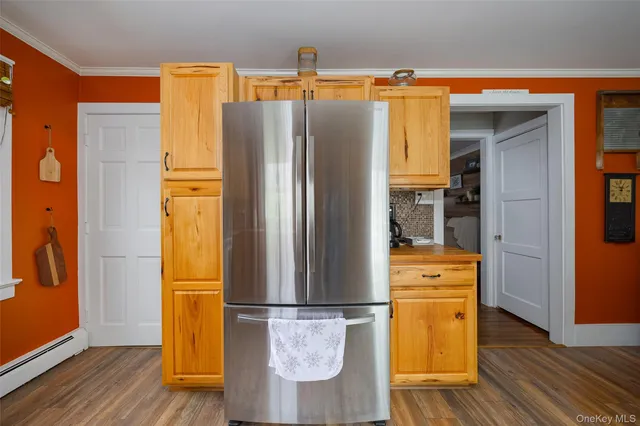a refrigerator freezer sitting inside of a kitchen