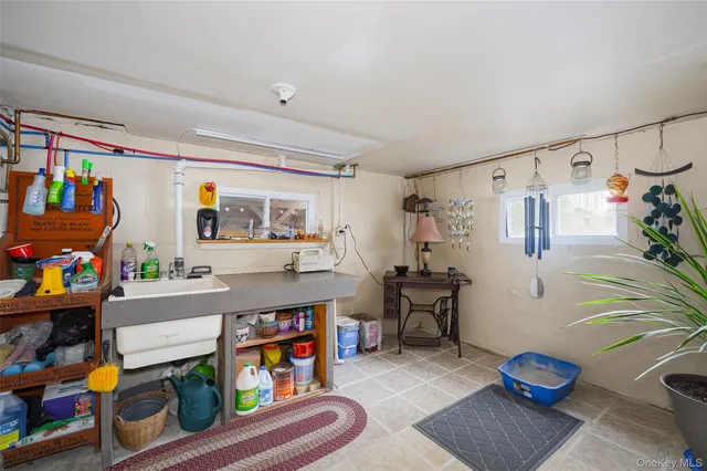 a spacious bedroom with a bed and a chandelier