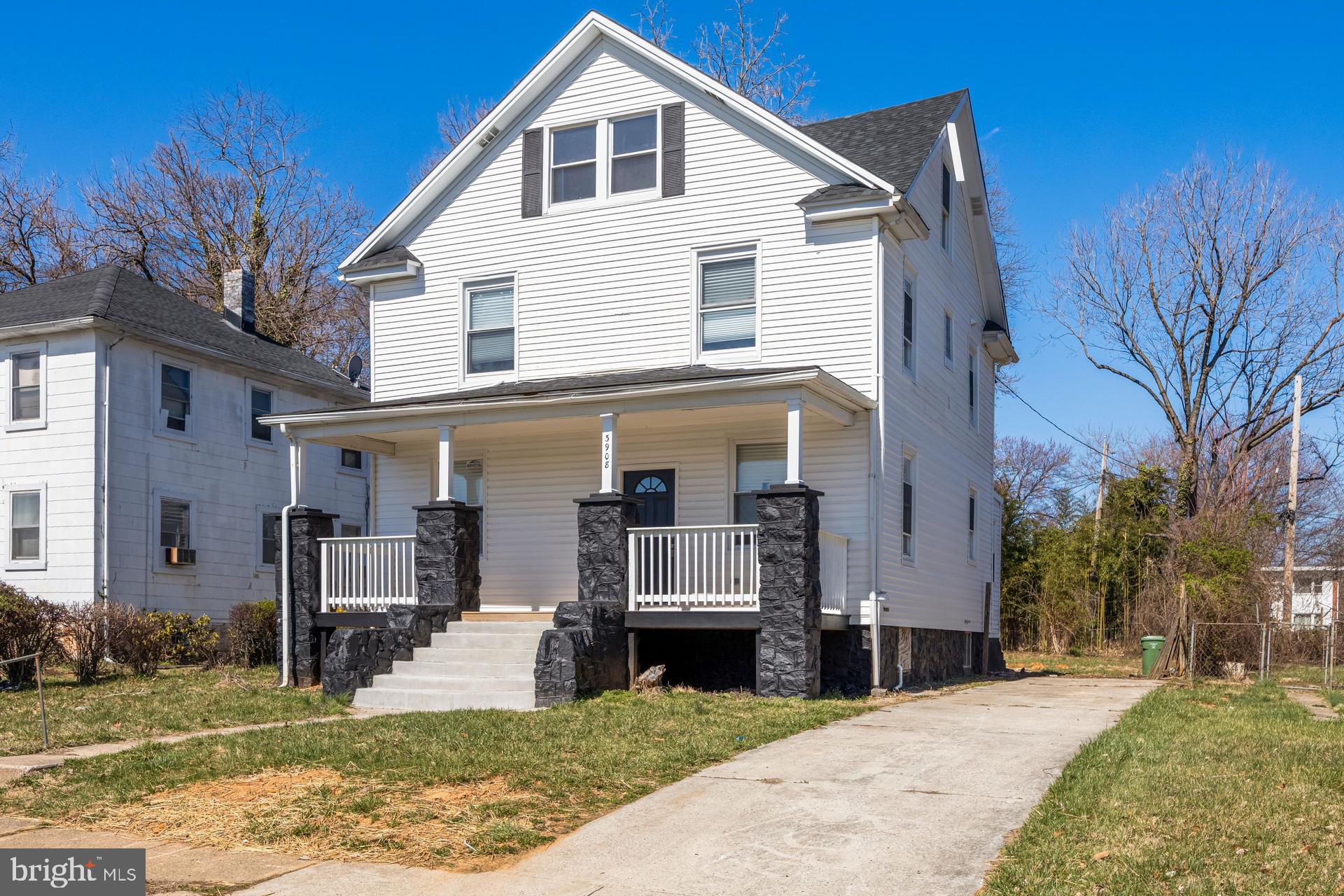 3908 Primrose Avenue Baltimore, MD 21215 - Photo 1 of 19 a front view of a house with a yard
