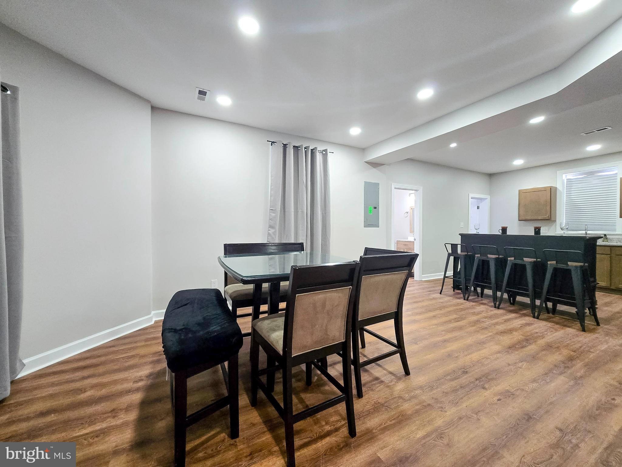 3908 Primrose Avenue Baltimore, MD 21215 - Photo 8 of 19 a view of a dining room with furniture