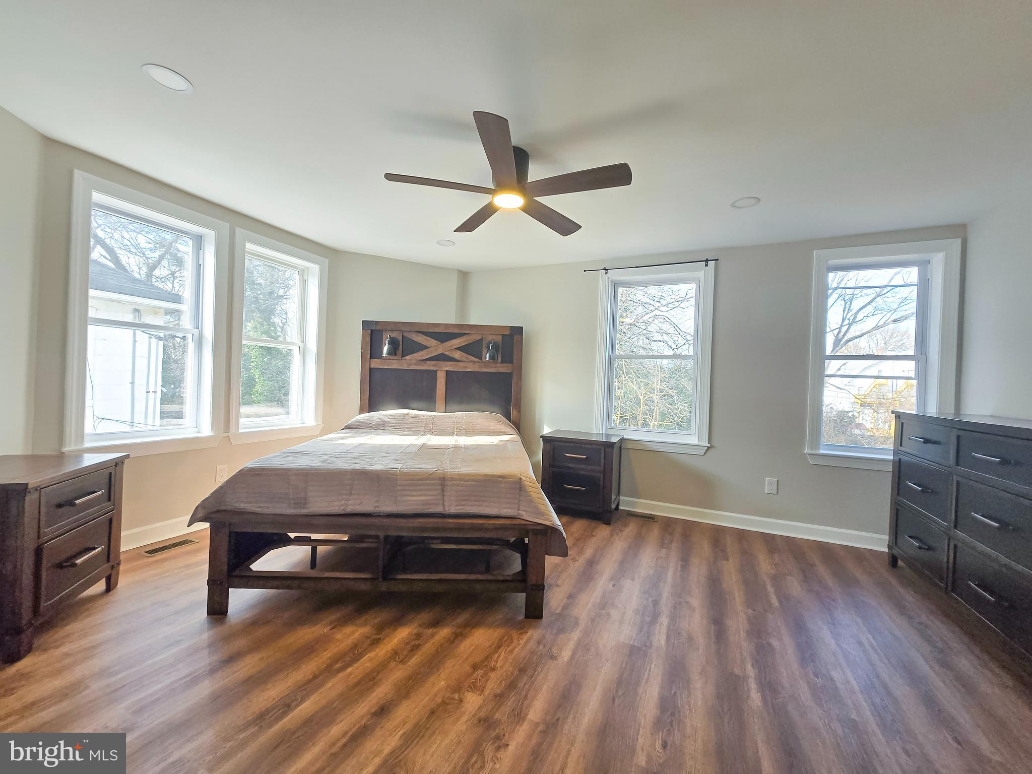 3908 Primrose Avenue Baltimore, MD 21215 - Photo 10 of 19 a living room with a bed furniture and a window