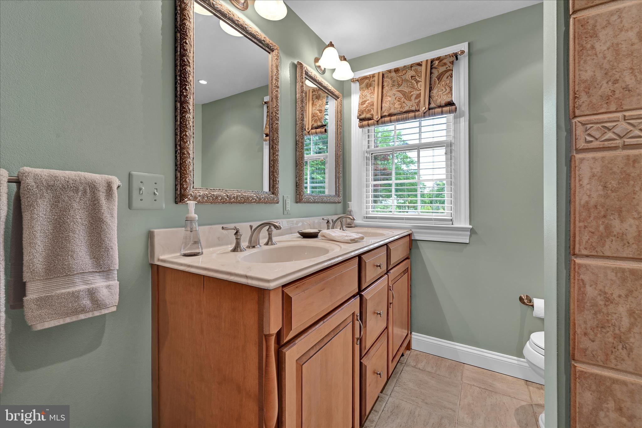 451 Cassatt Road Berwyn, PA 19312 - Photo 46 of 61 Hall Bathroom with Double Vanity and Tub Shower
