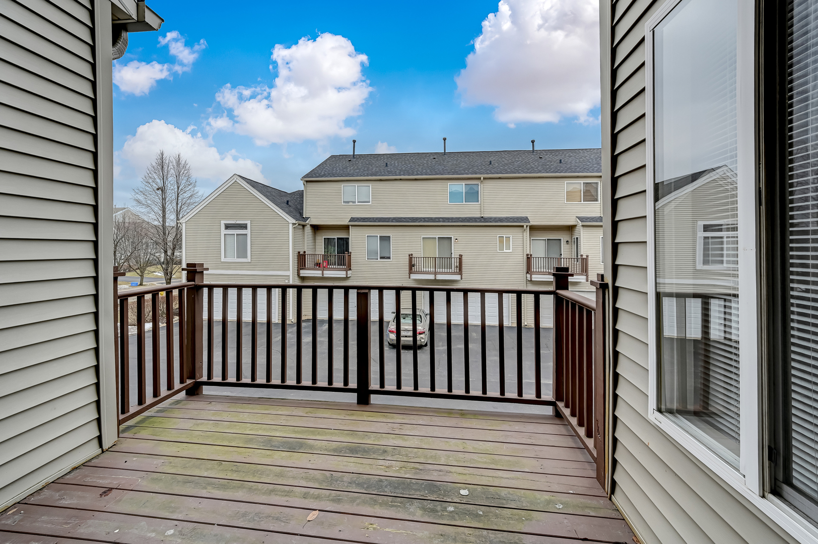 118 Enclave Circle, Unit C Bolingbrook, IL 60440 - Photo 12 of 27 a view of a balcony with wooden floor