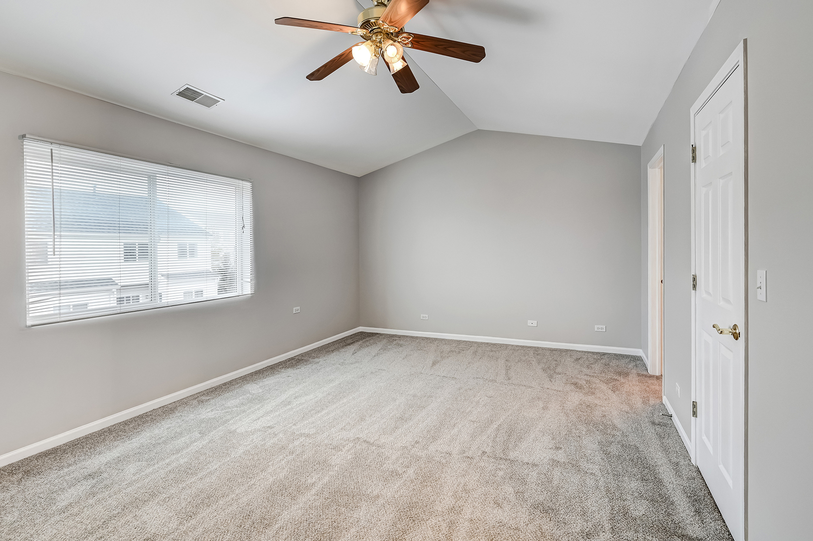 118 Enclave Circle, Unit C Bolingbrook, IL 60440 - Photo 15 of 27 a view of an empty room with a window