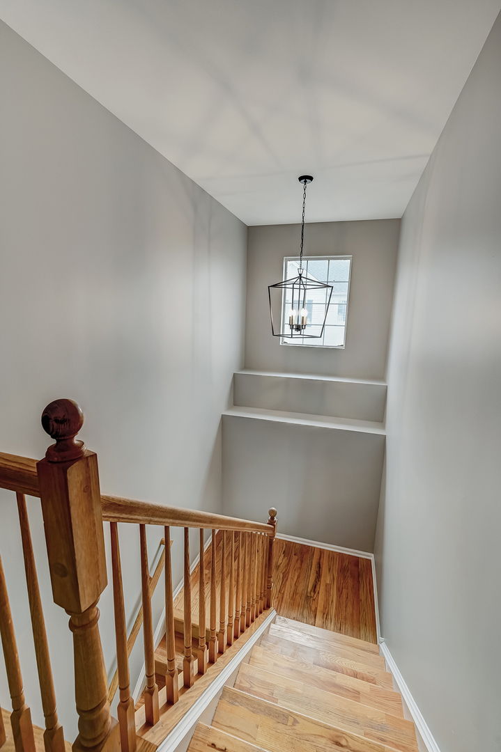 118 Enclave Circle, Unit C Bolingbrook, IL 60440 - Photo 20 of 27 a view of entryway with window and wooden floor