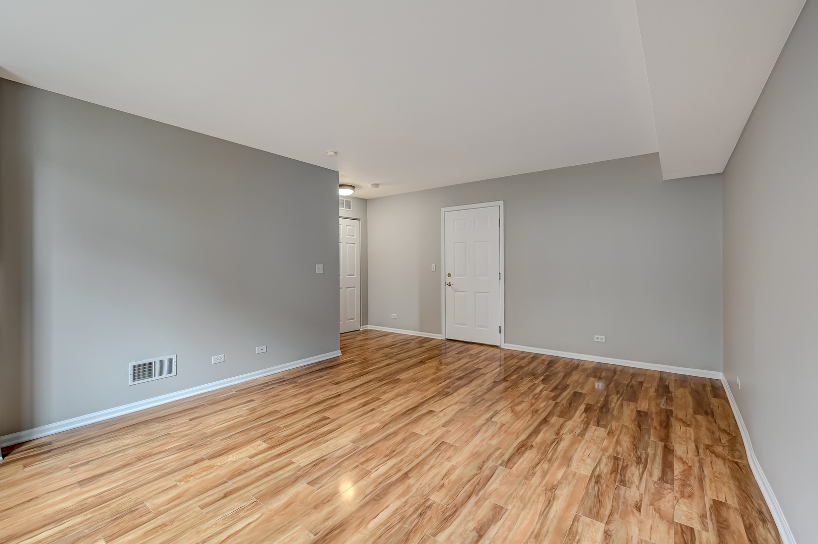 118 Enclave Circle, Unit C Bolingbrook, IL 60440 - Photo 22 of 27 a view of empty room with wooden floor