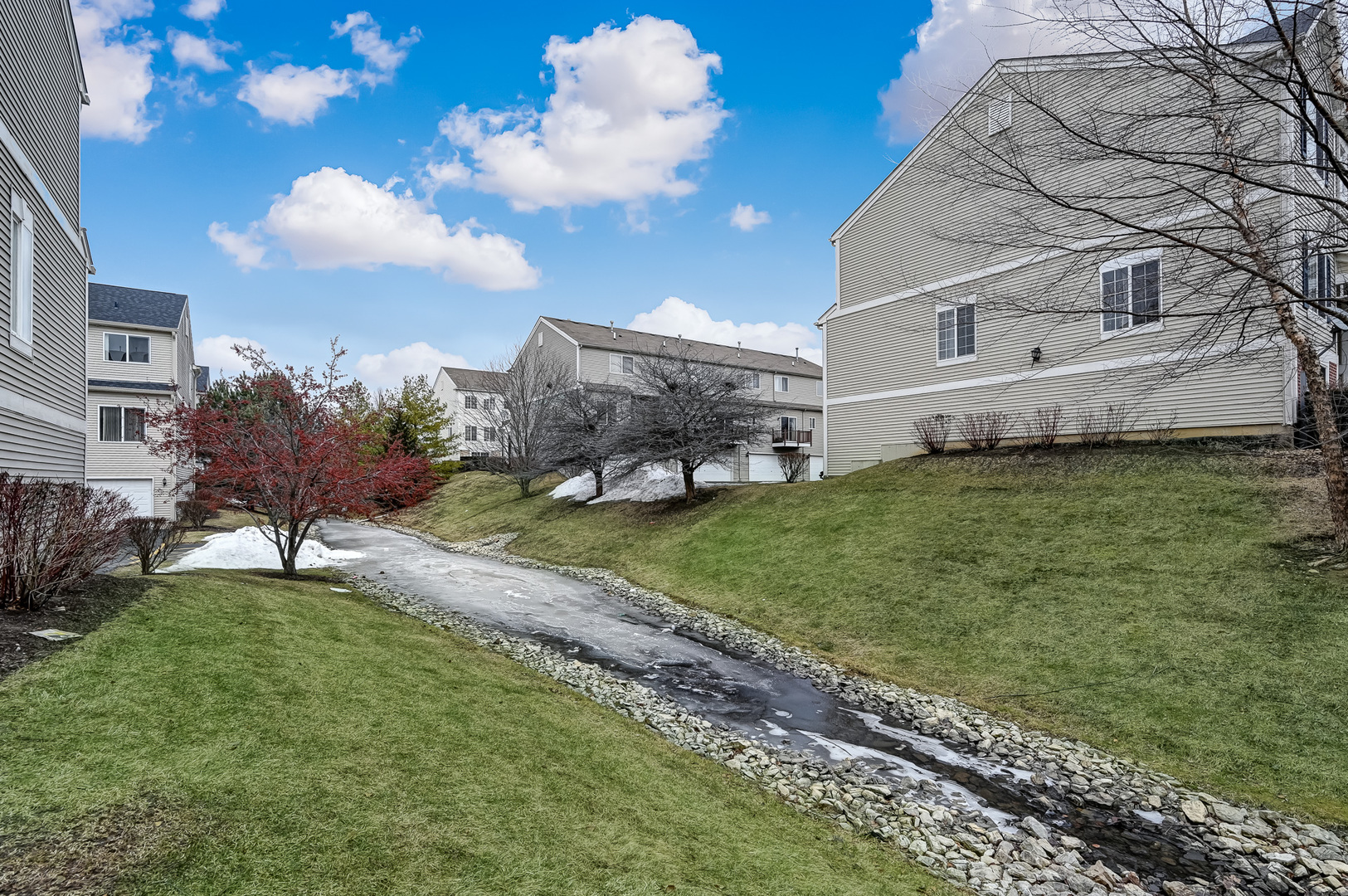 118 Enclave Circle, Unit C Bolingbrook, IL 60440 - Photo 23 of 27 a white house with a big yard and large tree