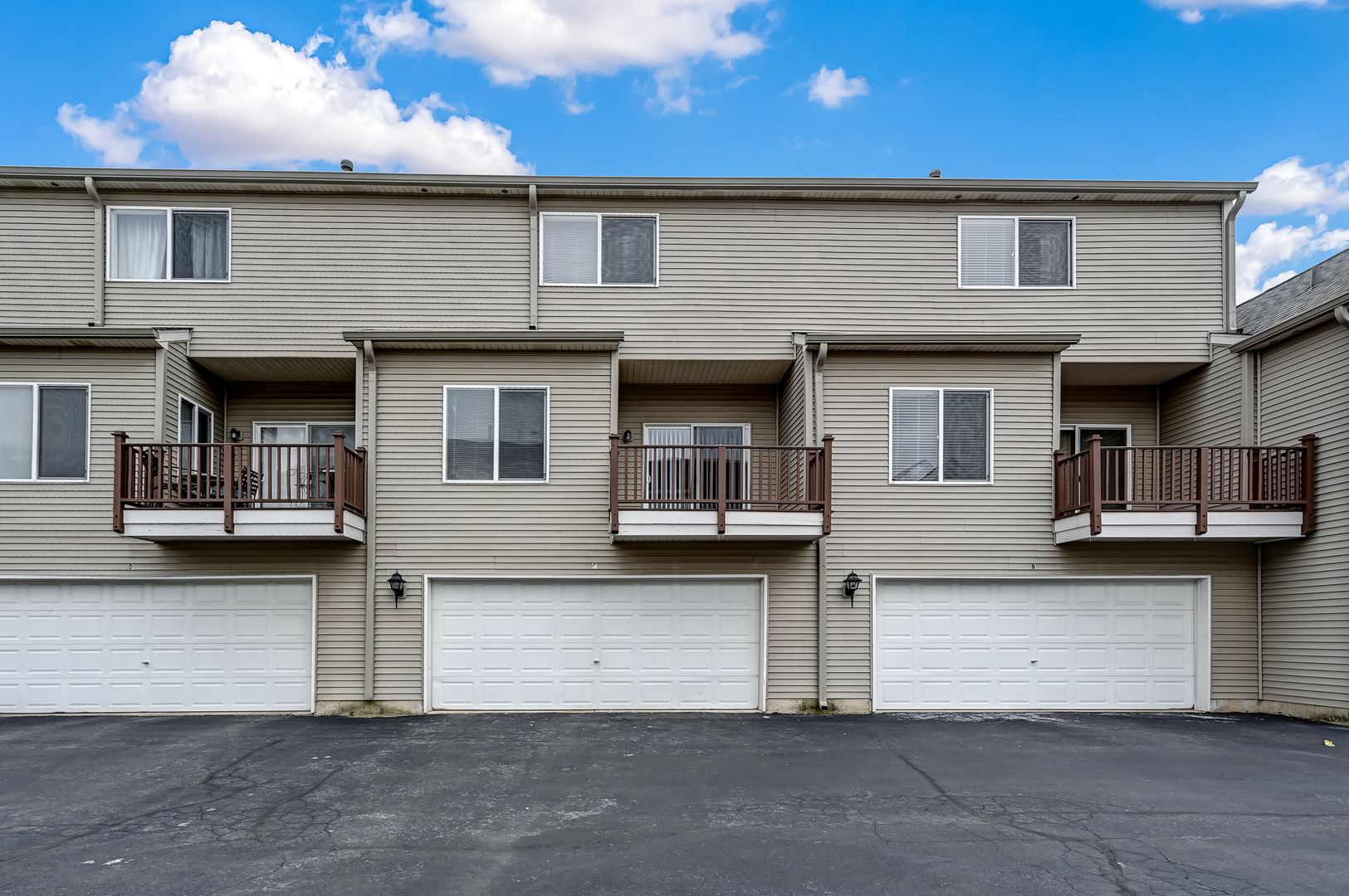 118 Enclave Circle, Unit C Bolingbrook, IL 60440 - Photo 24 of 27 a front view of a house with garage