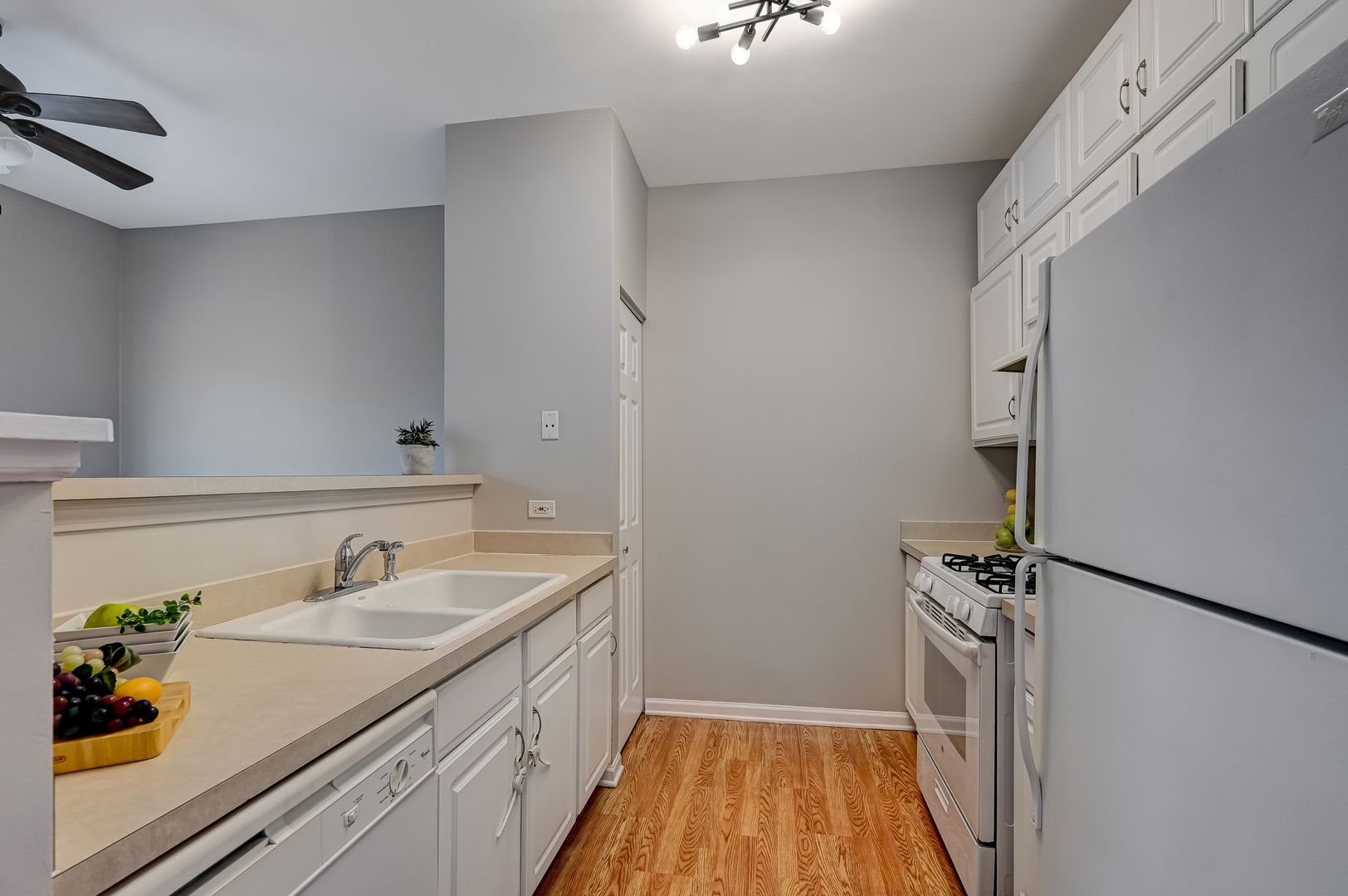 118 Enclave Circle, Unit C Bolingbrook, IL 60440 - Photo 7 of 27 a bathroom with a sink and a mirror