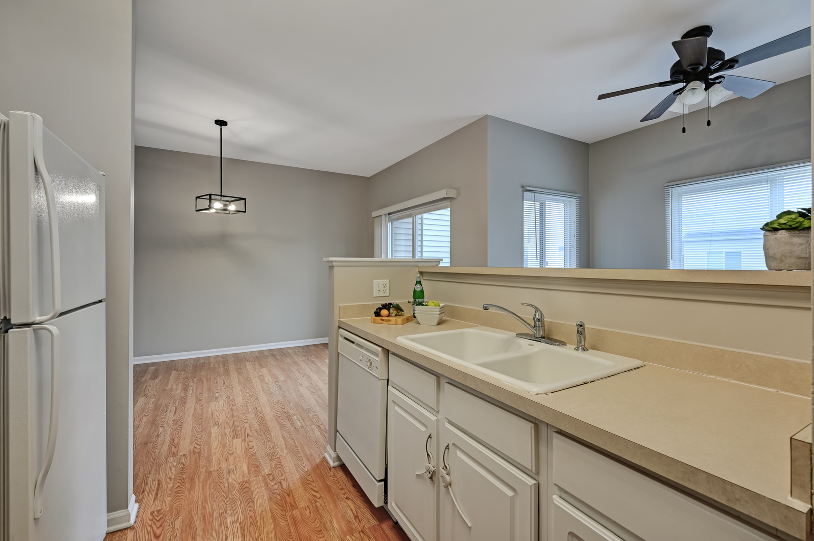 118 Enclave Circle, Unit C Bolingbrook, IL 60440 - Photo 9 of 27 a bathroom with a sink a mirror and a shower