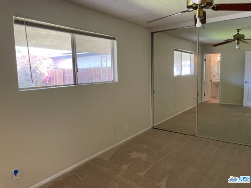70161 Chappel Road Rancho Mirage, CA 92270 - Photo 11 of 20 en empty room with window and outdoor view