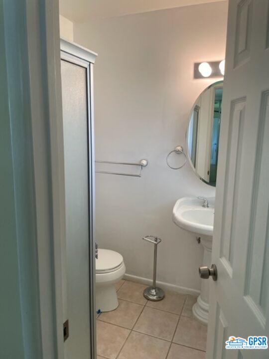 70161 Chappel Road Rancho Mirage, CA 92270 - Photo 17 of 20 a bathroom with a granite countertop toilet and a sink