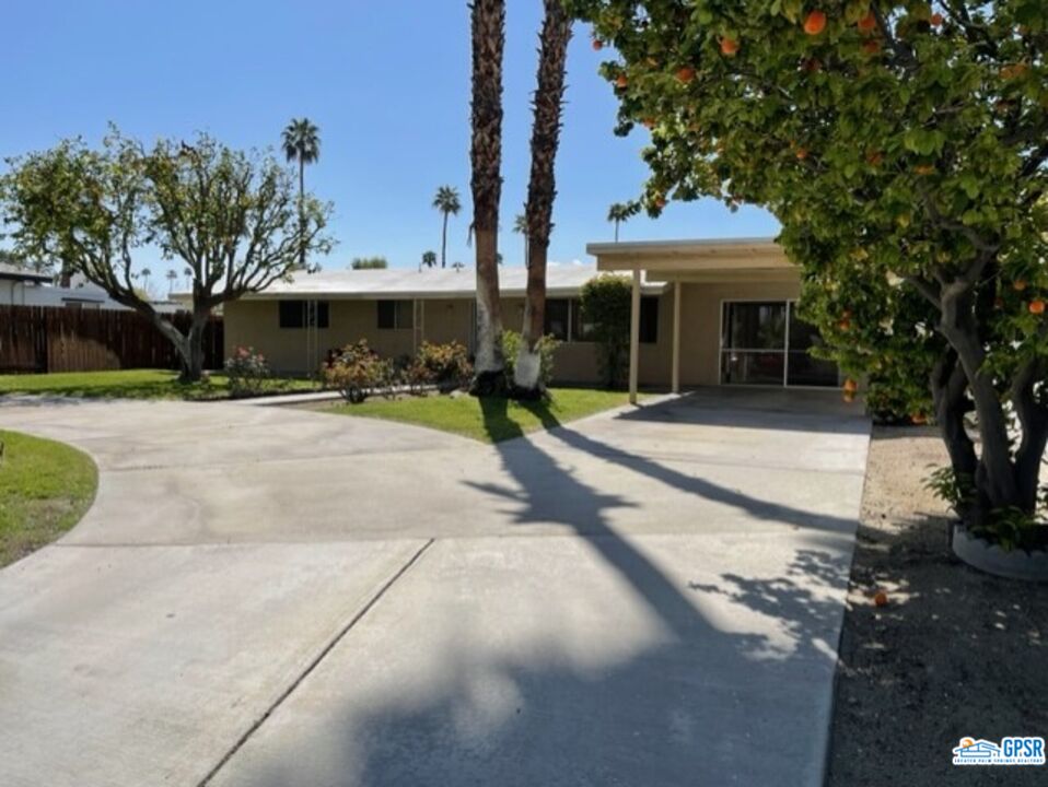 70161 Chappel Road Rancho Mirage, CA 92270 - Photo 7 of 20 a front view of a building with a garden