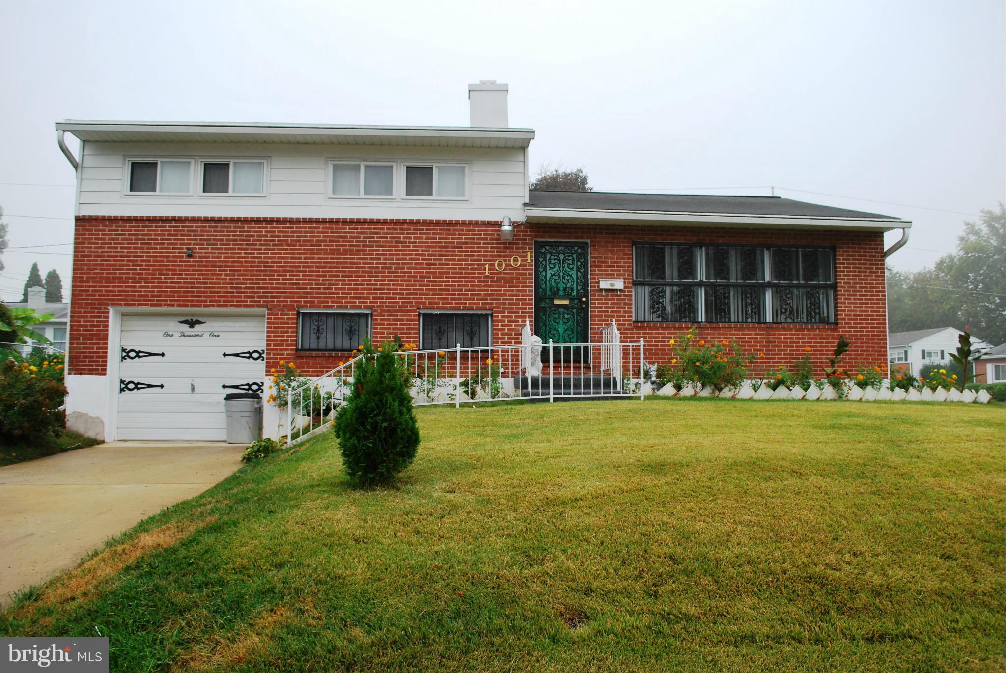 1001 Hallimont Road Catonsville, MD 21228 - Photo 1 of 19 a front view of a house with garden