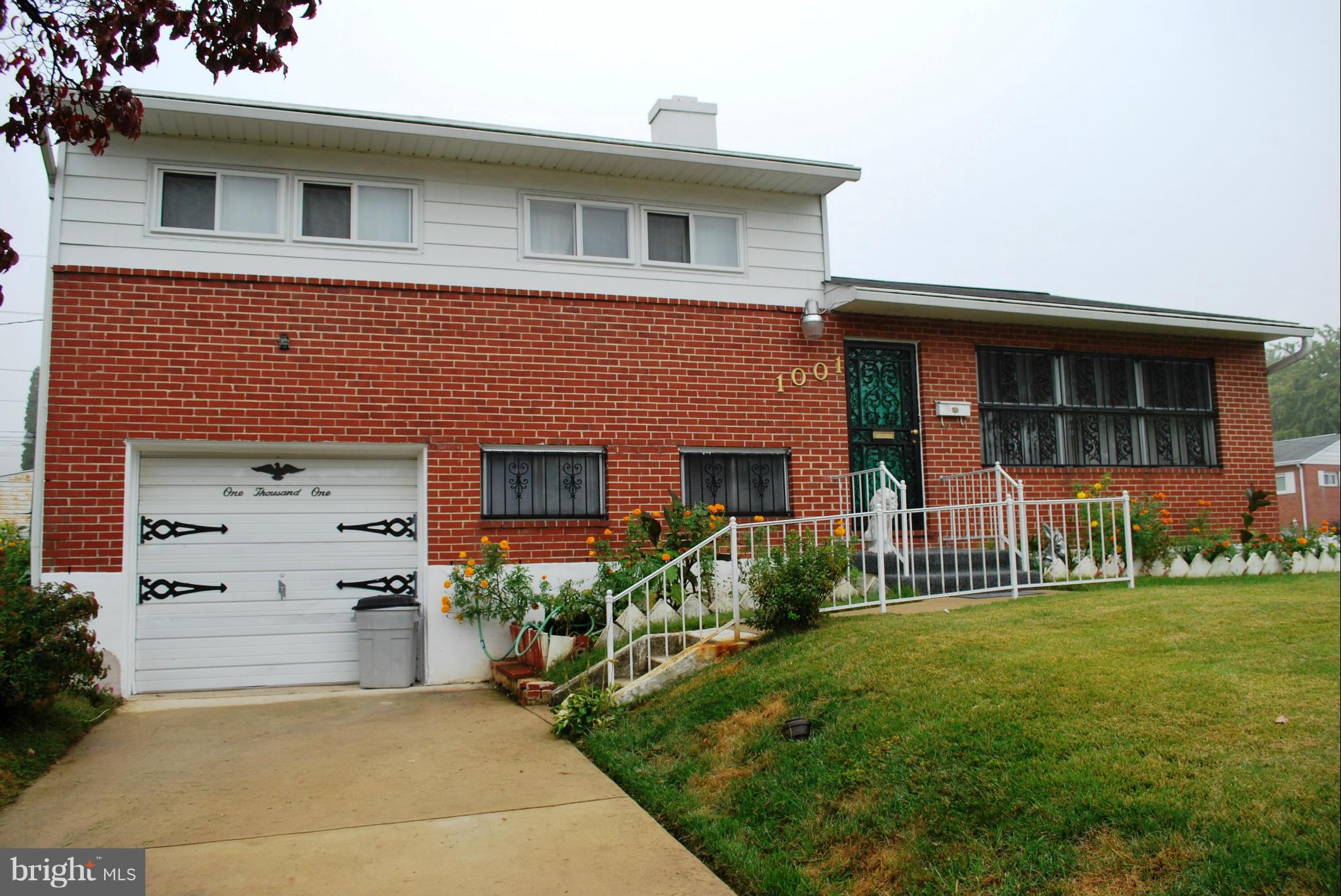 1001 Hallimont Road Catonsville, MD 21228 - Photo 2 of 19 a front view of a house with a garden