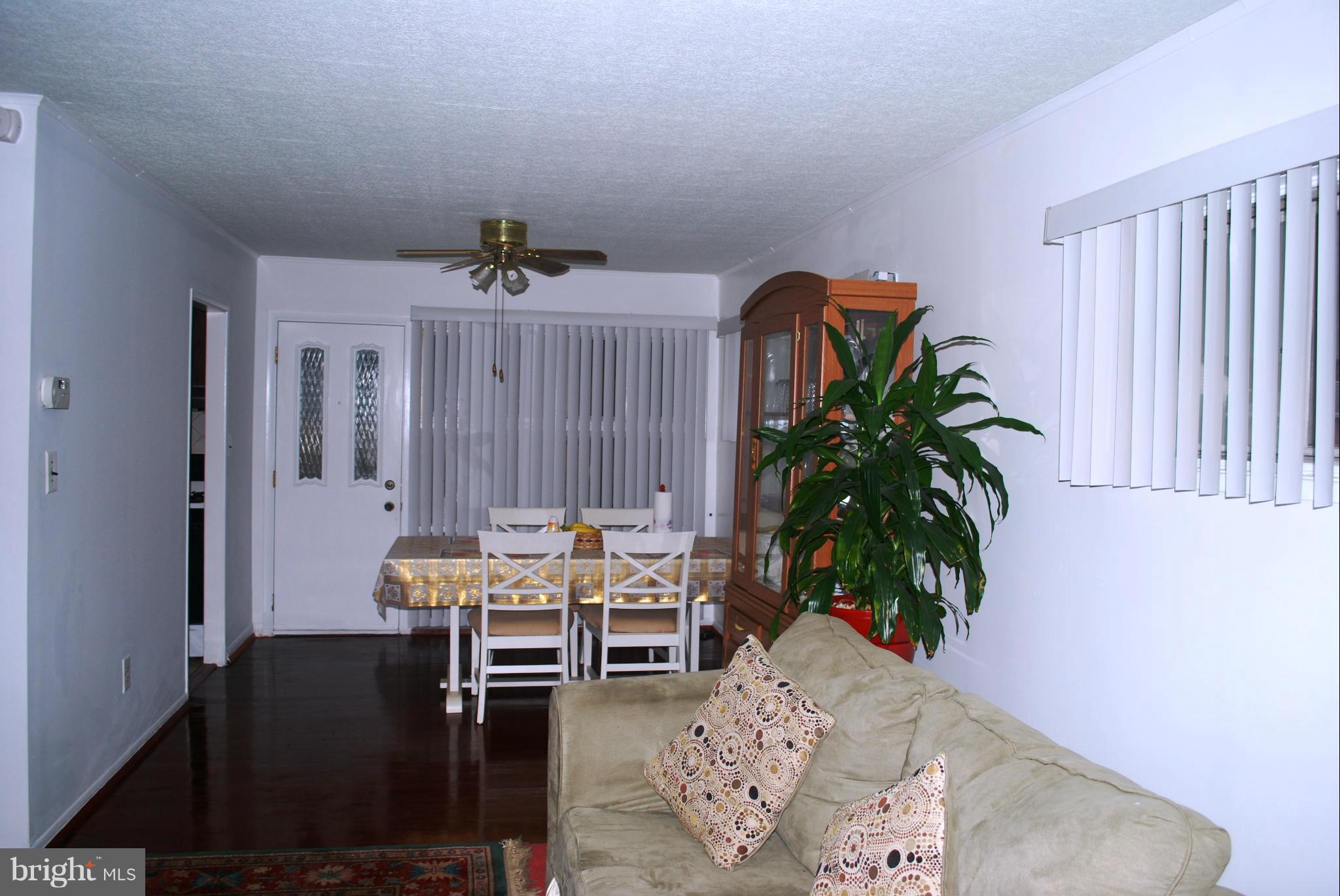 1001 Hallimont Road Catonsville, MD 21228 - Photo 11 of 19 a living room with furniture potted plant and a window