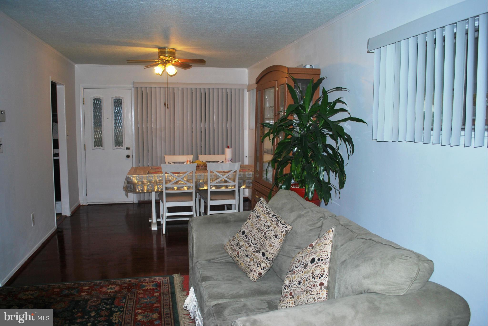 1001 Hallimont Road Catonsville, MD 21228 - Photo 12 of 19 a living room with furniture and a potted plant