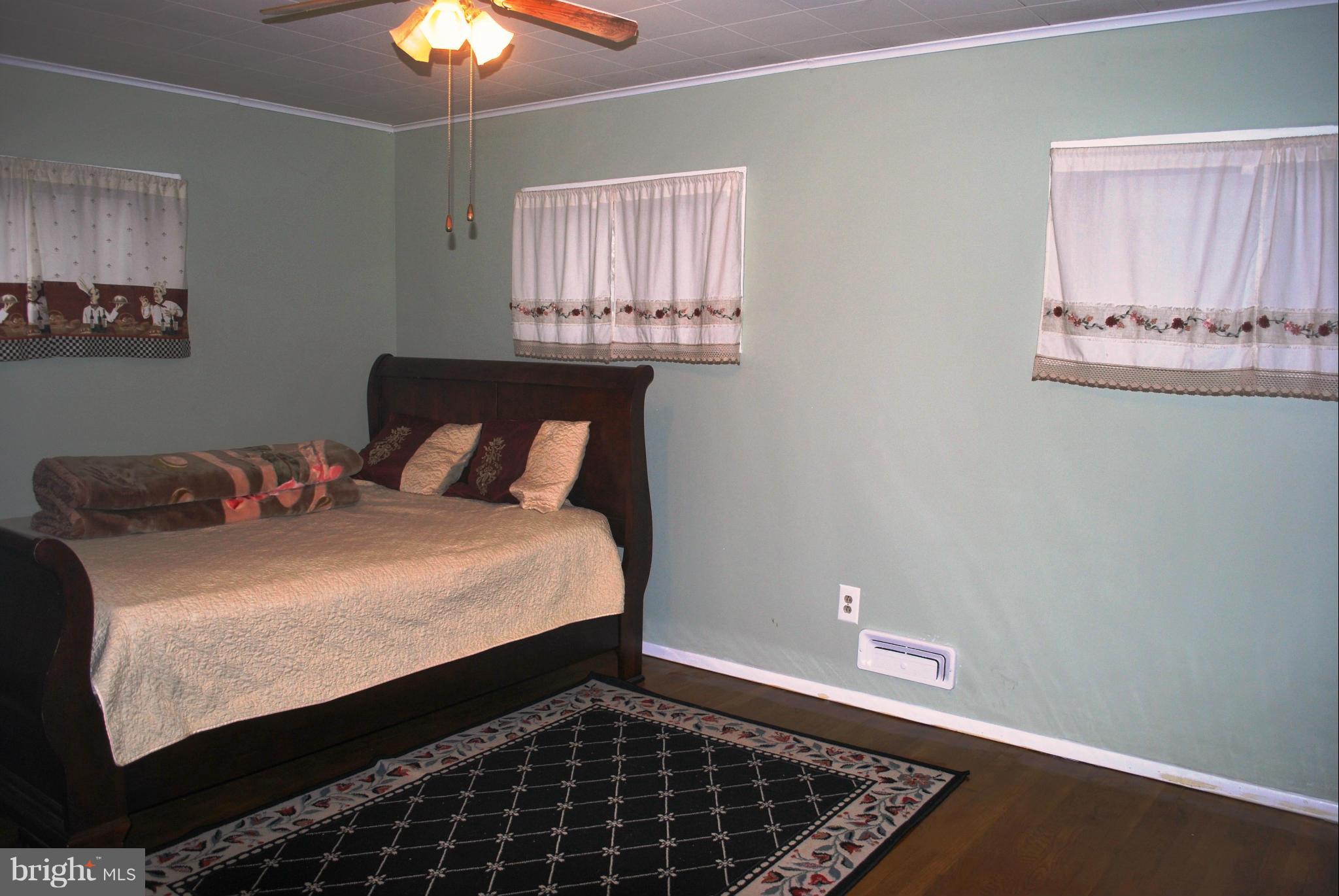 1001 Hallimont Road Catonsville, MD 21228 - Photo 17 of 19 a bedroom with a bed and a window