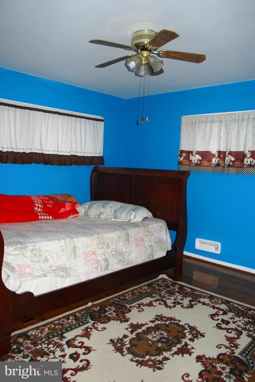 1001 Hallimont Road Catonsville, MD 21228 - Photo 18 of 19 a bed sitting in a bedroom next to a window