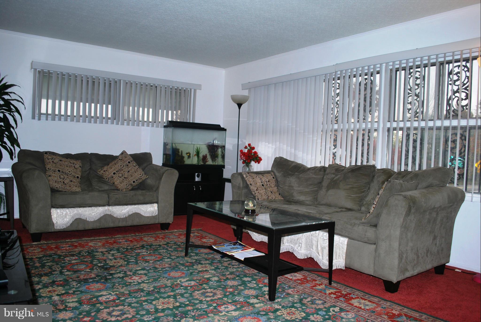 1001 Hallimont Road Catonsville, MD 21228 - Photo 10 of 19 a living room with furniture and a rug