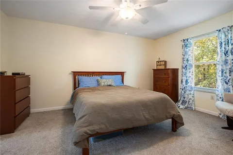 a bedroom with a bed and window