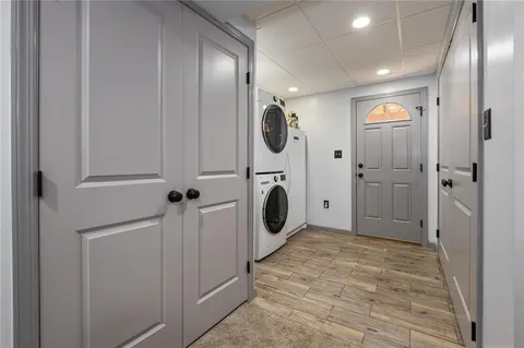 a bathroom with a mirror a bathtub and a shower