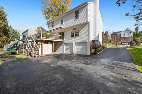 a view of a park with large trees