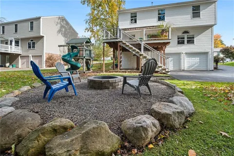 a view of house with yard outdoor seating area and entertaining space