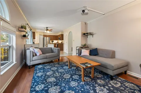 a living room with furniture and a rug