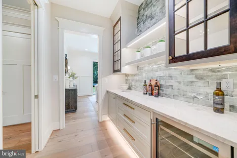 a kitchen with stainless steel appliances a sink and cabinets