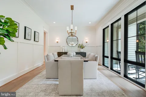 a very nice looking dining room with a large window with outer view
