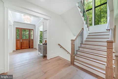 a bedroom with furniture and a large window