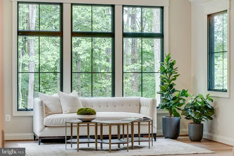 a view of a hallway with paintings on the wall