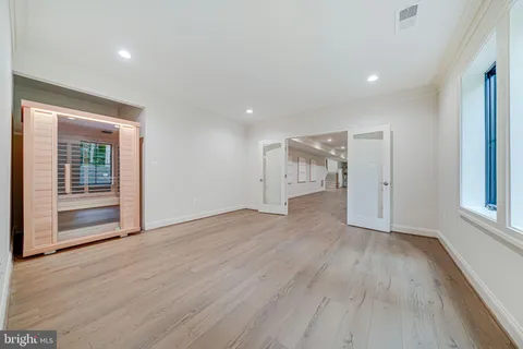 a view of a house with a yard and potted plants