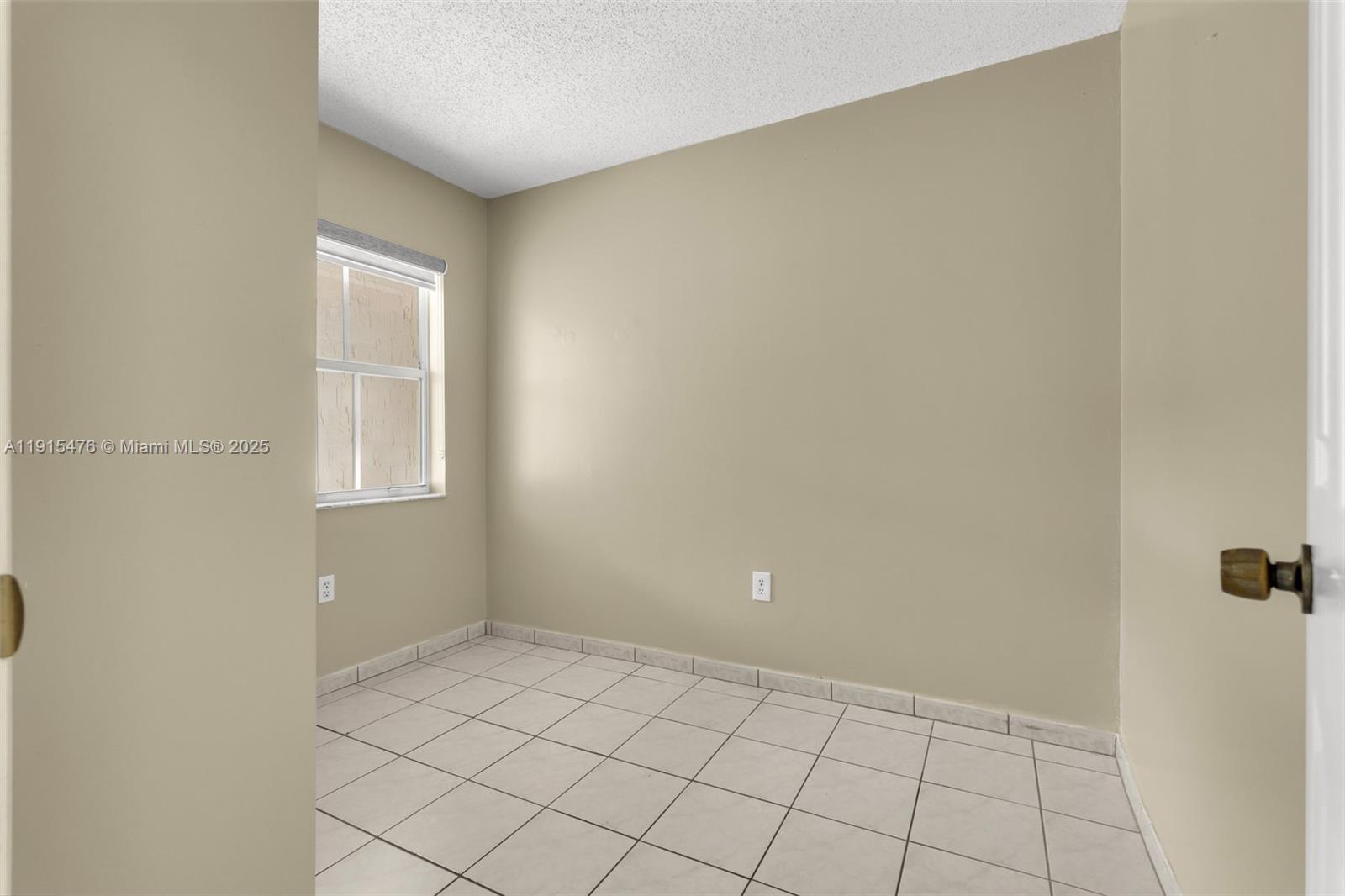6263 Southwest 139th Avenue Miami, FL 33183 - Photo 15 of 38 a view of an empty room and window