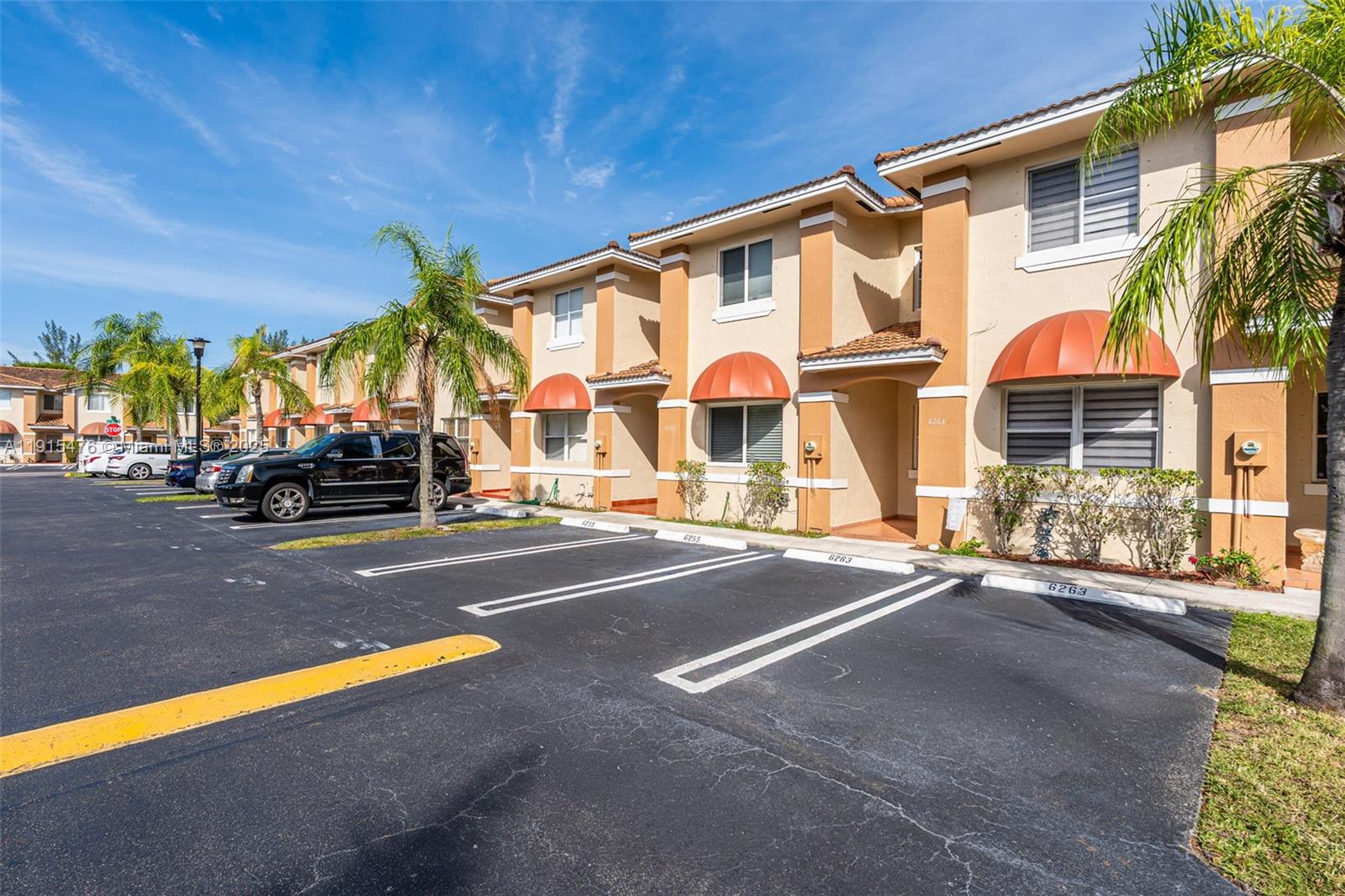 6263 Southwest 139th Avenue Miami, FL 33183 - Photo 2 of 38 a view of a street with cars