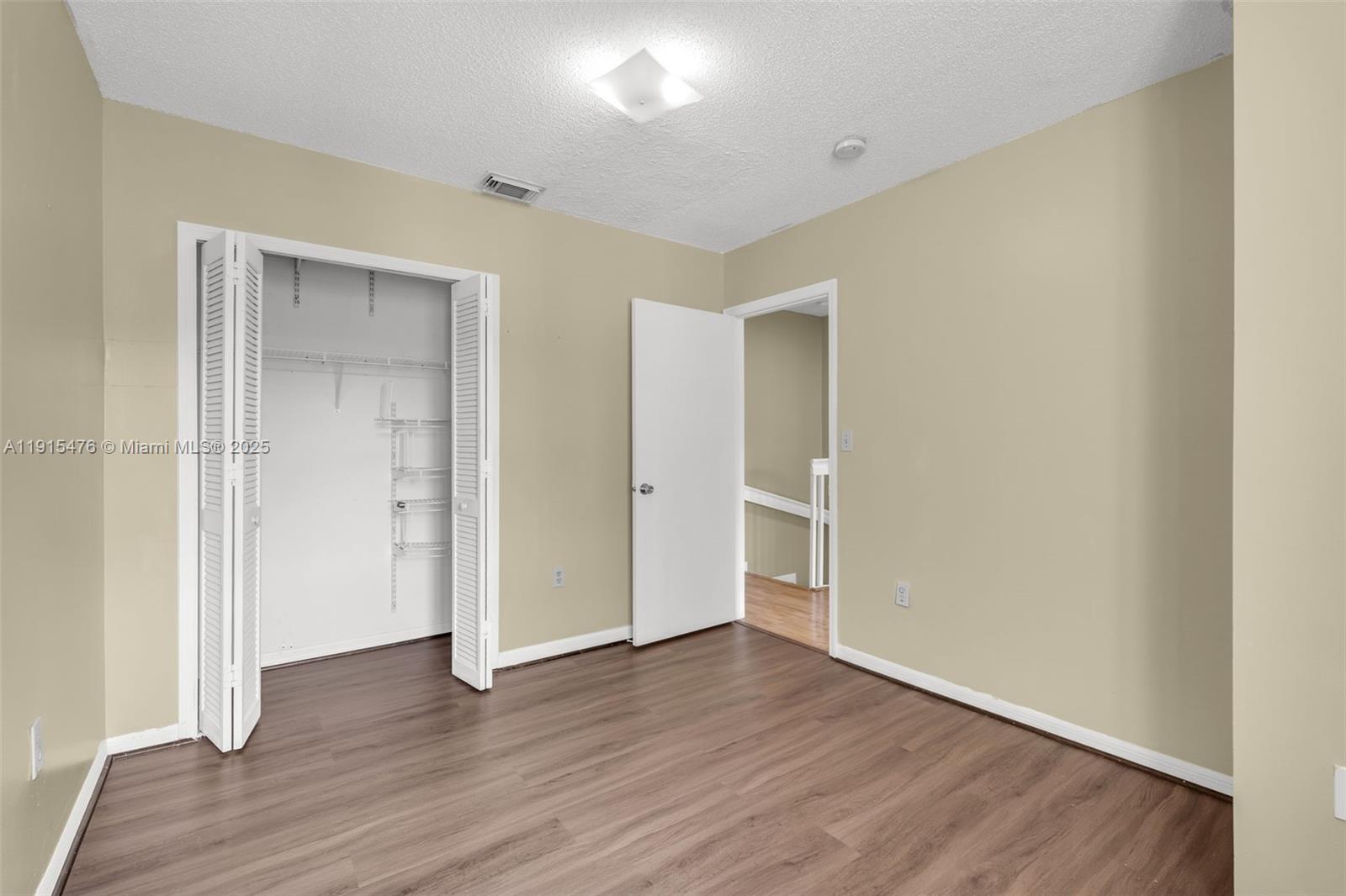 6263 Southwest 139th Avenue Miami, FL 33183 - Photo 22 of 38 wooden floor in an empty room