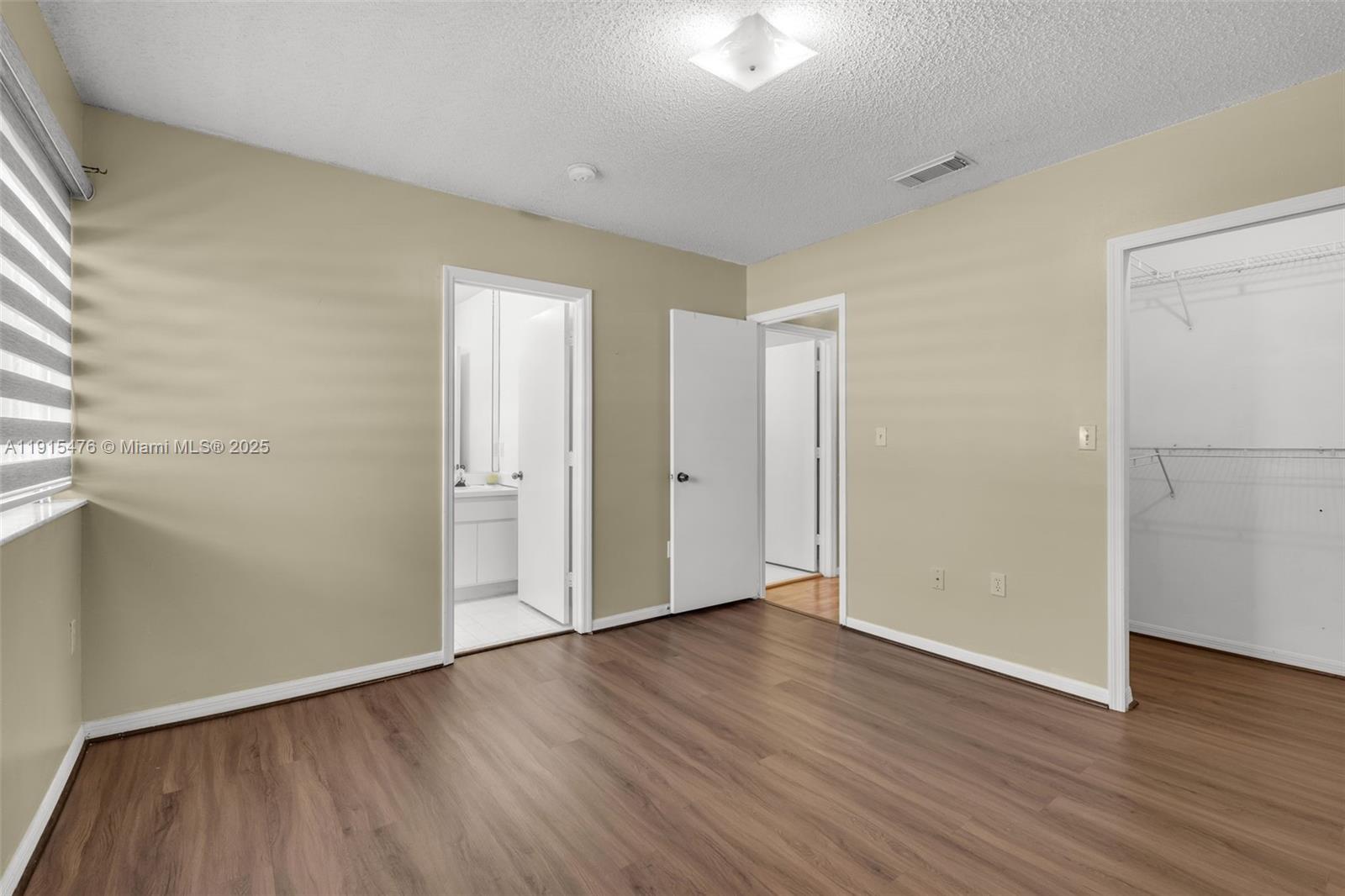 6263 Southwest 139th Avenue Miami, FL 33183 - Photo 24 of 38 an empty room with wooden floor and a window