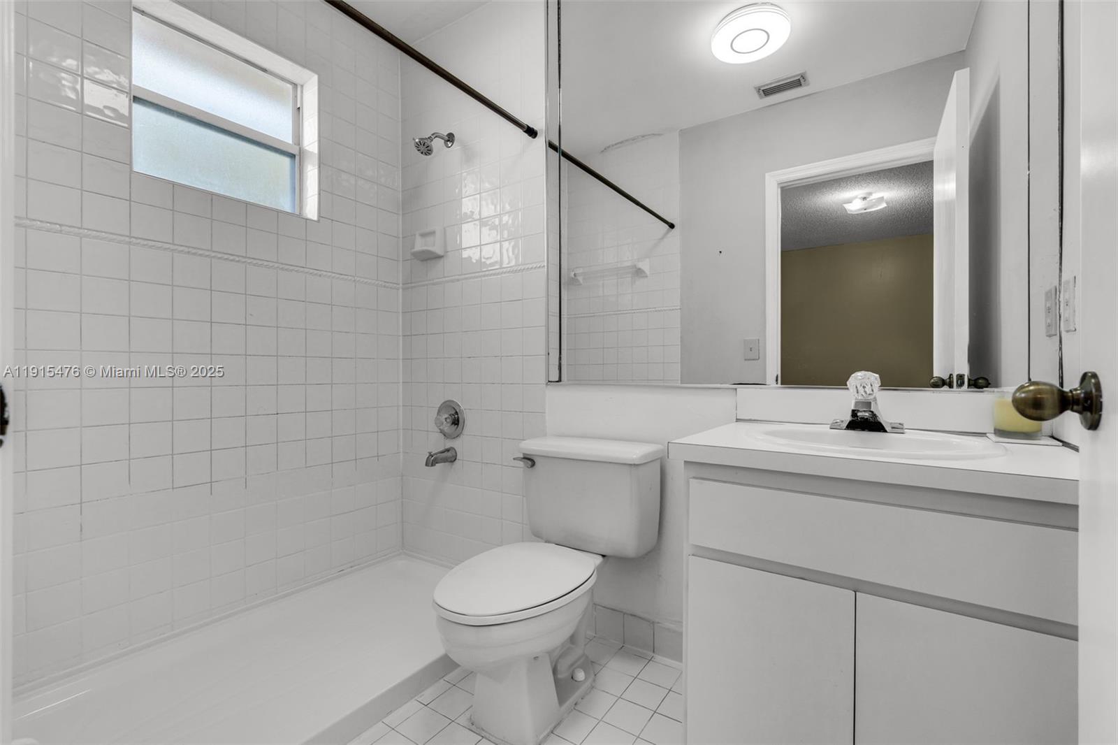 6263 Southwest 139th Avenue Miami, FL 33183 - Photo 25 of 38 a bathroom with a sink a toilet and shower