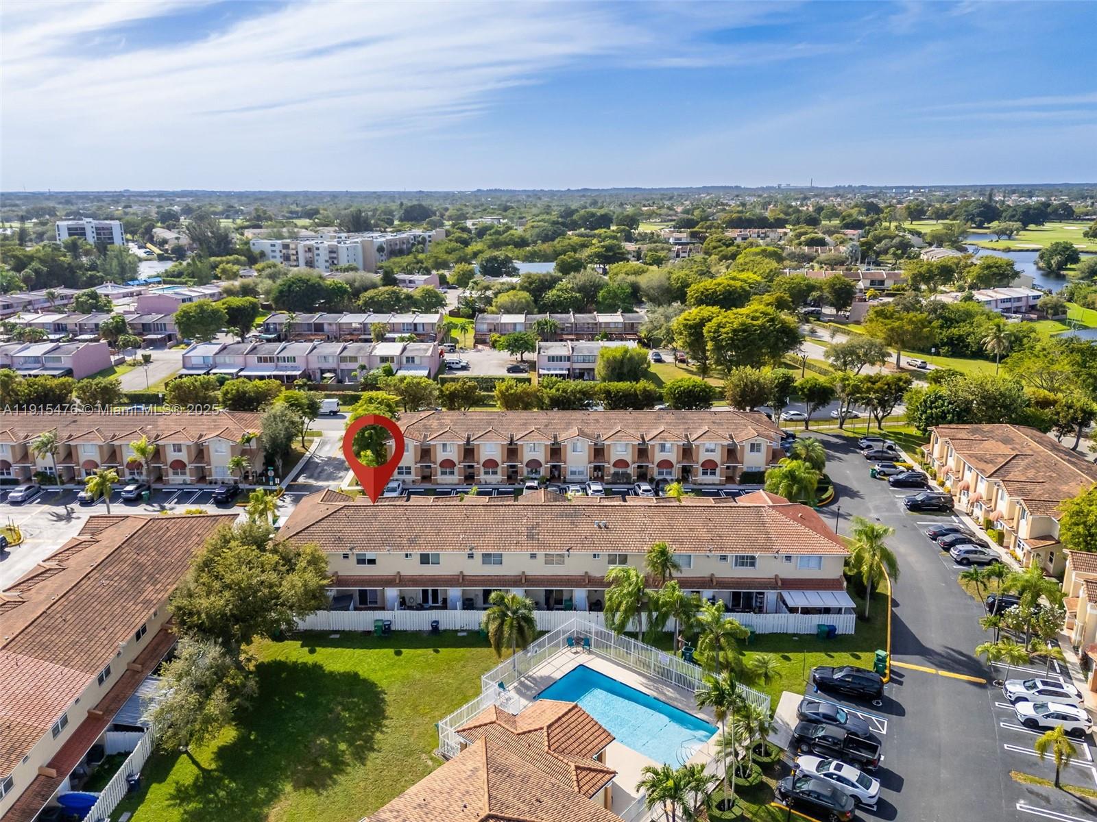6263 Southwest 139th Avenue Miami, FL 33183 - Photo 33 of 38 an aerial view of a city with lots of residential buildings ocean and mountain view in back