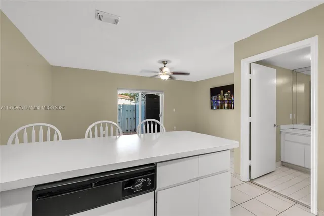 a view of a kitchen from the hallway
