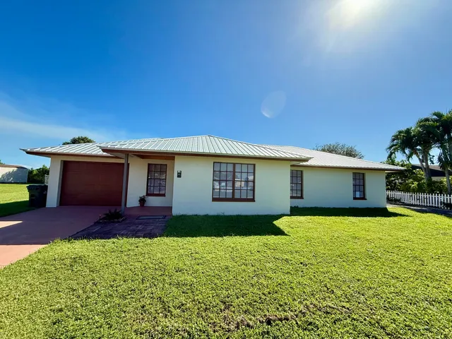 a house view with a garden space