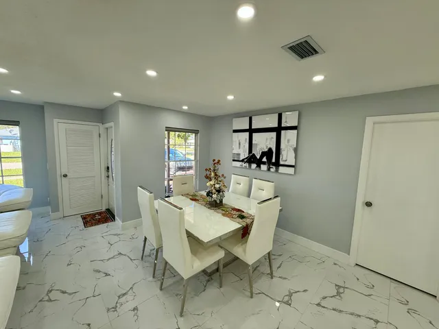 a view of a dining room with furniture