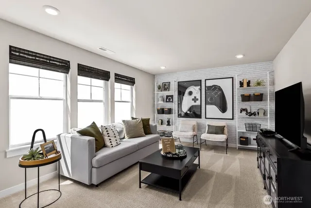 a living room with furniture a flat screen tv and a large window